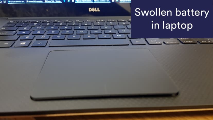 Swollen battery in laptop pusing touchpad up Swollen battery in laptop pusing touchpad up